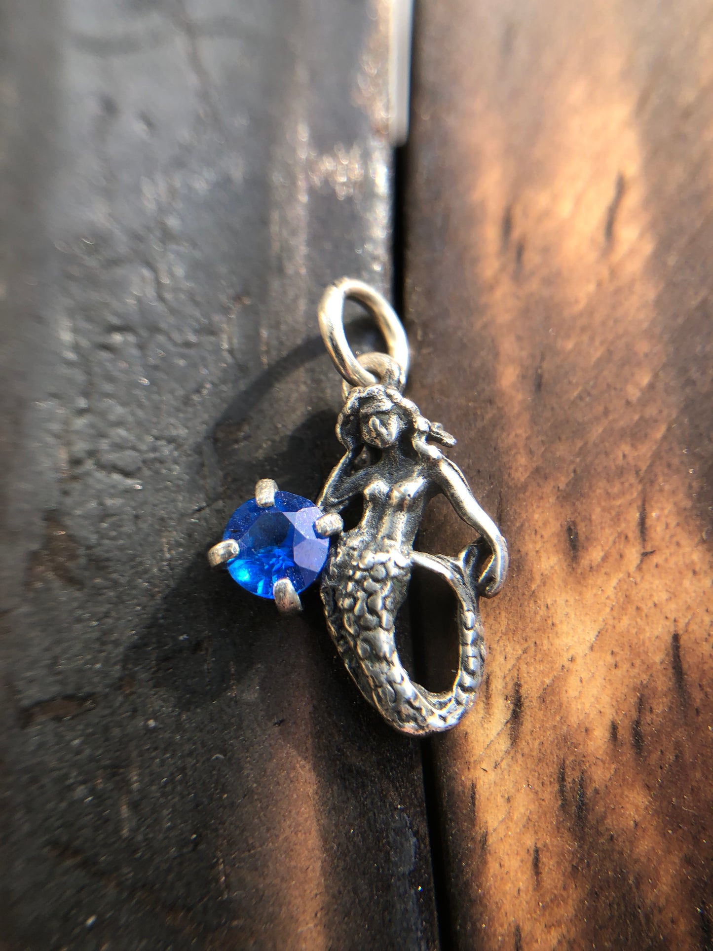 Sterling Silver Mermaid Pendant set with a 5mm Titanic Blue Topaz