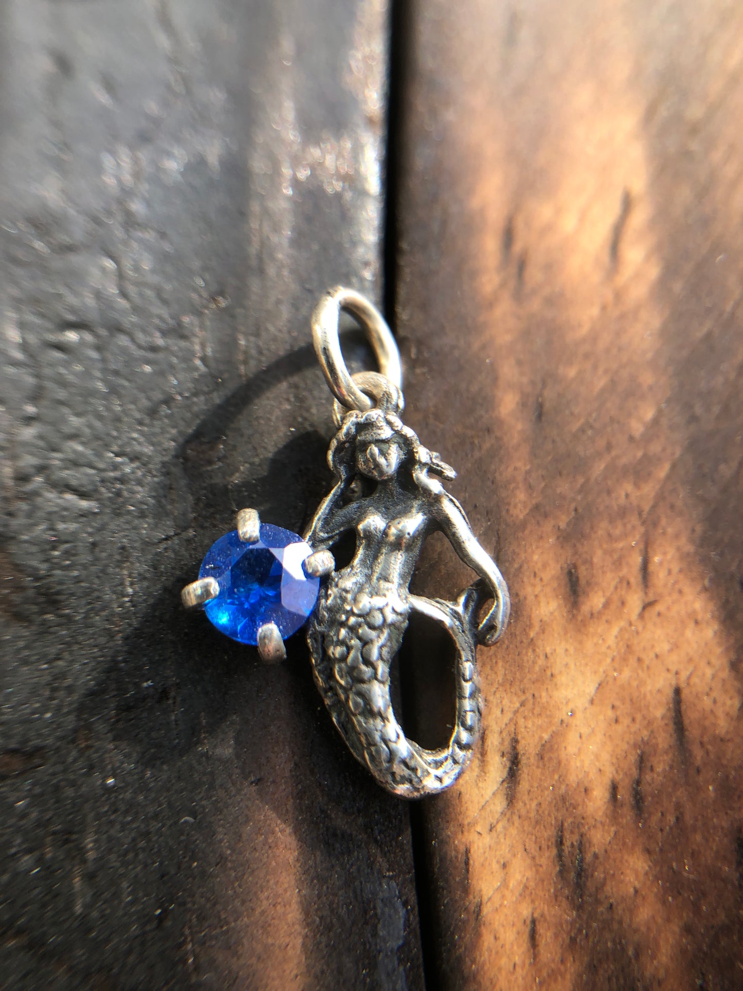 Sterling Silver Mermaid Pendant set with a 5mm Titanic Blue Topaz