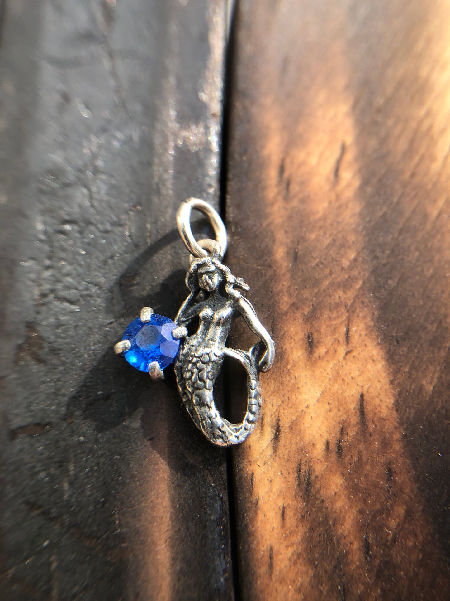 Sterling Silver Mermaid Pendant set with a 5mm Titanic Blue Topaz