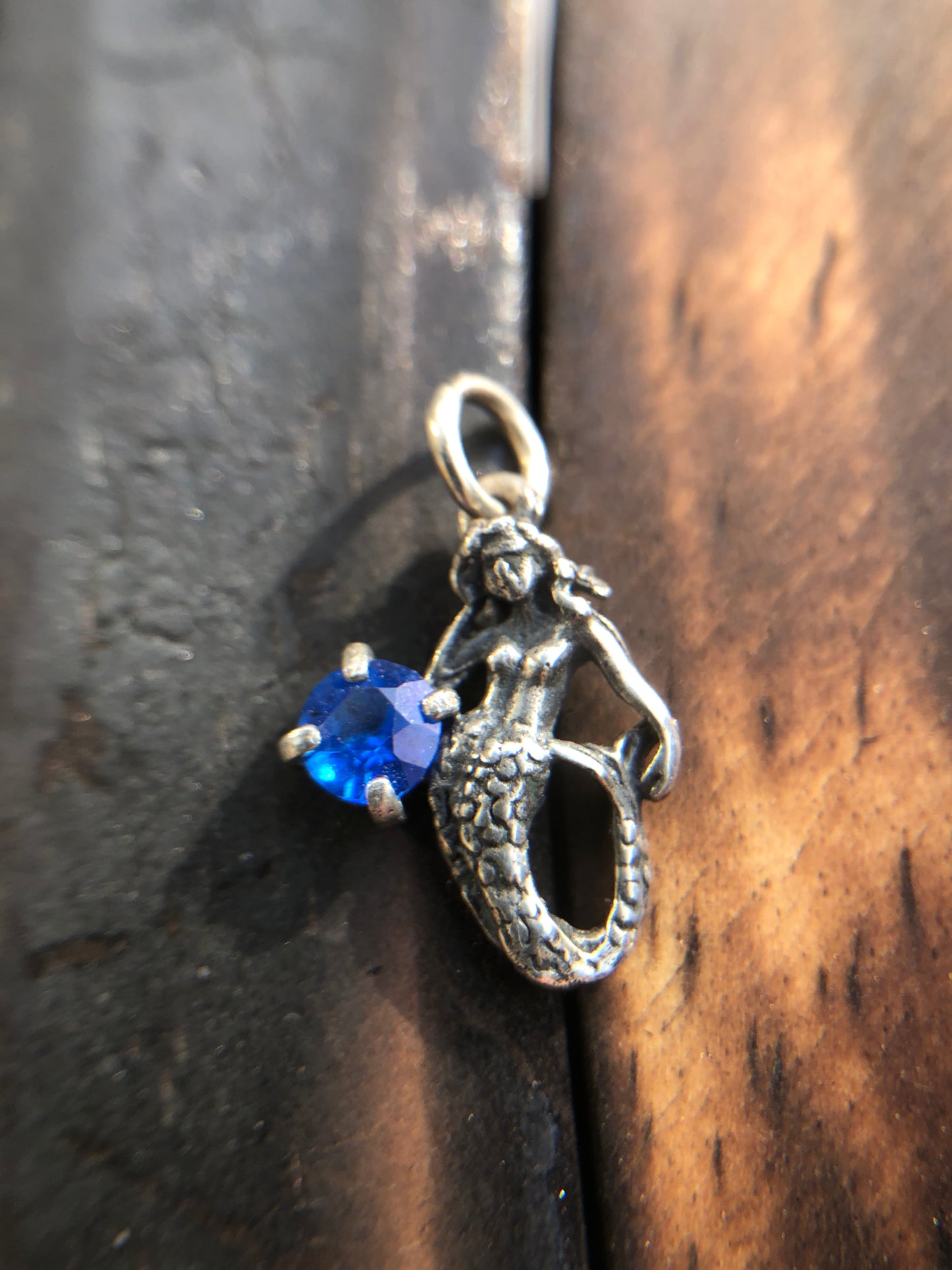 Sterling Silver Mermaid Pendant set with a 5mm Titanic Blue Topaz