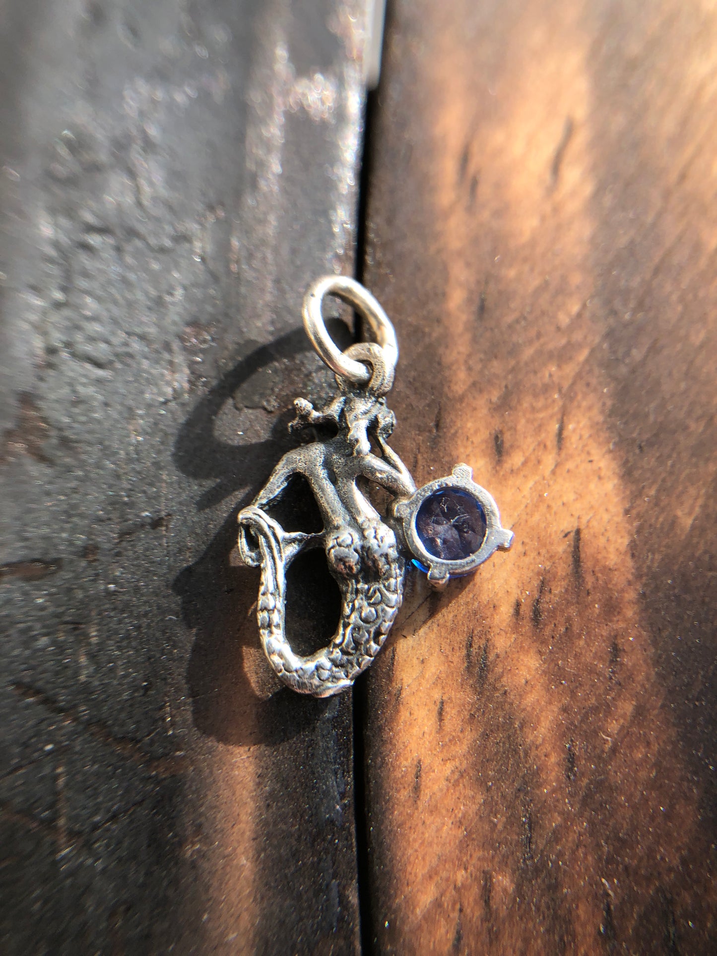 Sterling Silver Mermaid Pendant set with a 5mm Titanic Blue Topaz