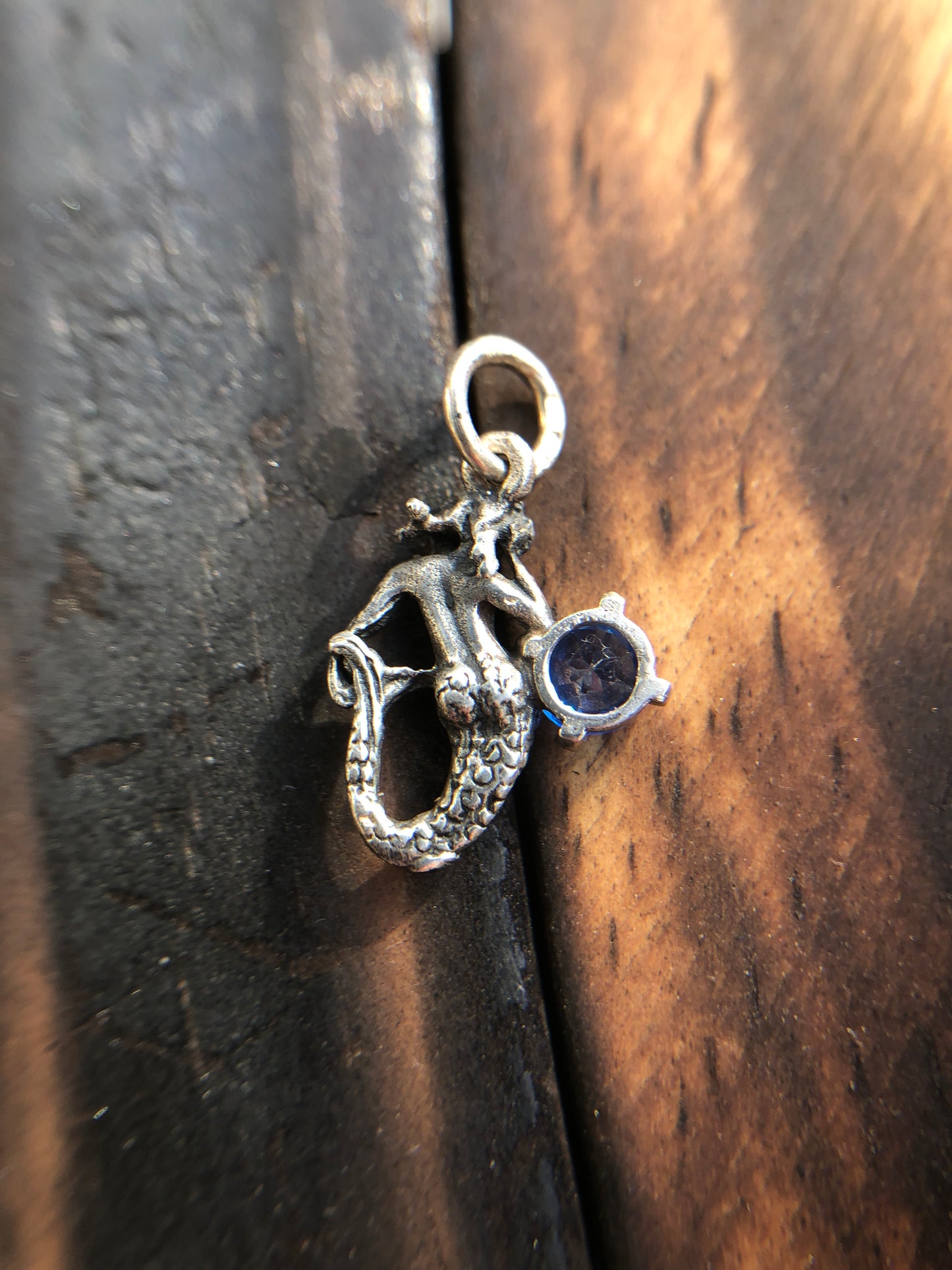 Sterling Silver Mermaid Pendant set with a 5mm Titanic Blue Topaz