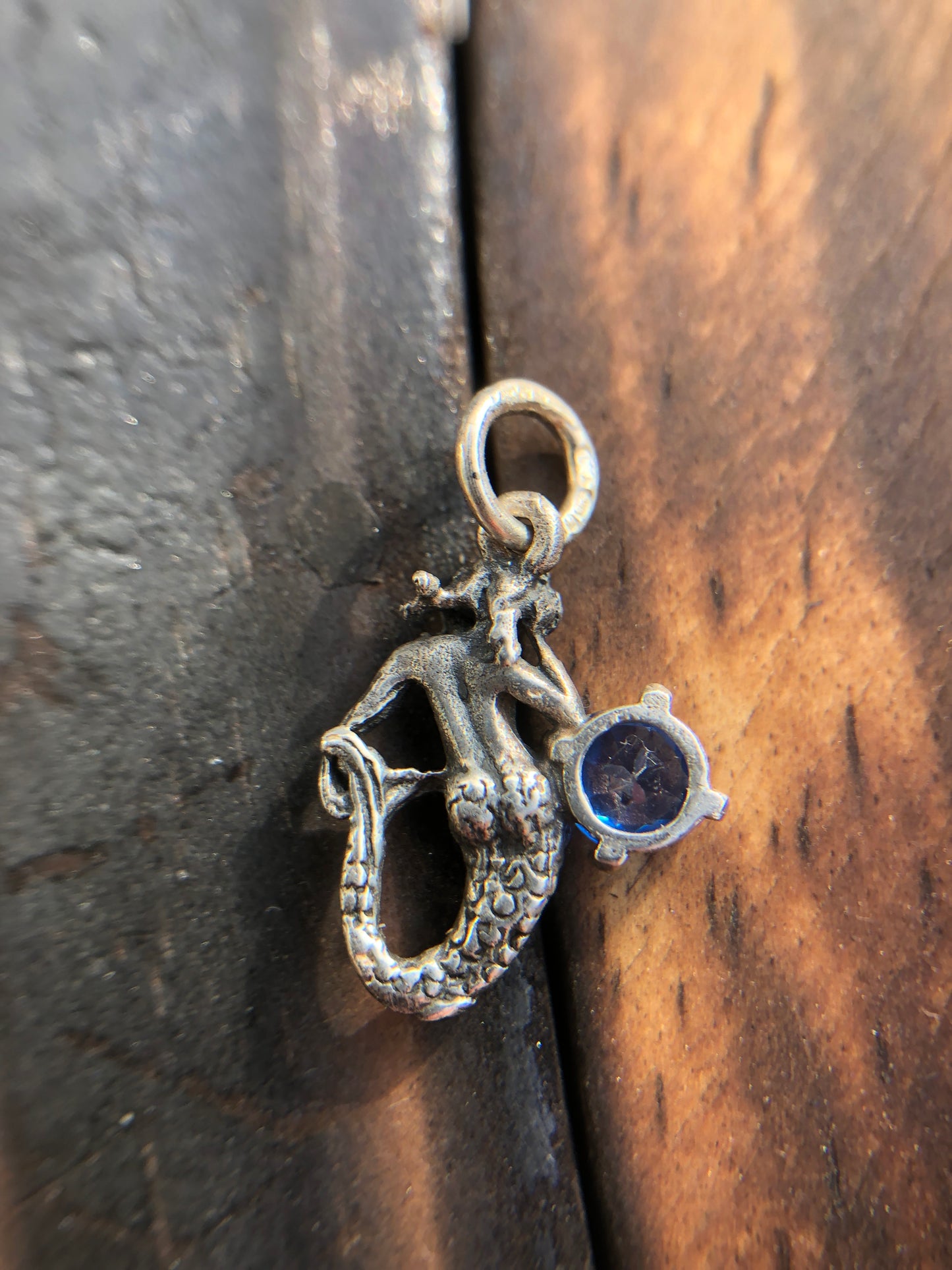 Sterling Silver Mermaid Pendant set with a 5mm Titanic Blue Topaz