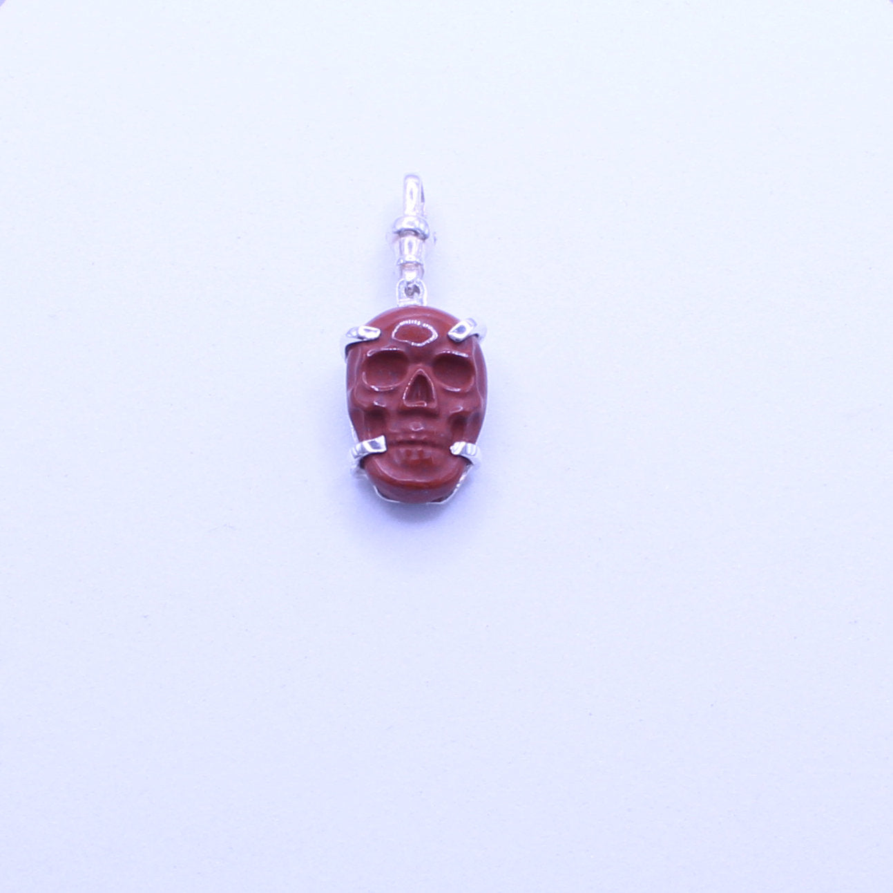 Hand Carved red jasper skull pendant sterling silver